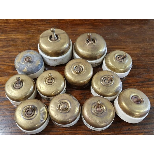 511 - Collection of Twelve Vintage Brass and Ceramic Light Switches