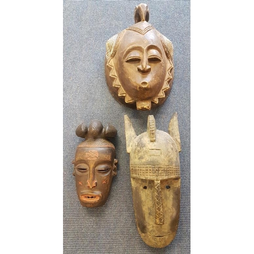 612 - Three Antique African Carved Tribal Masks, largest c.11 x 15in