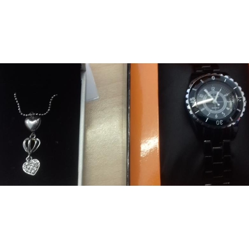 193 - White Metal Pendant and Chain along with a Sports Watch