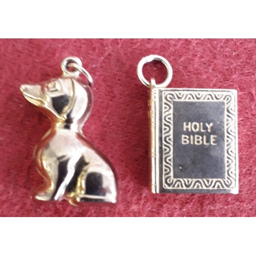 164 - Two 9ct Gold Pendants (seated dog and Holy Bible)