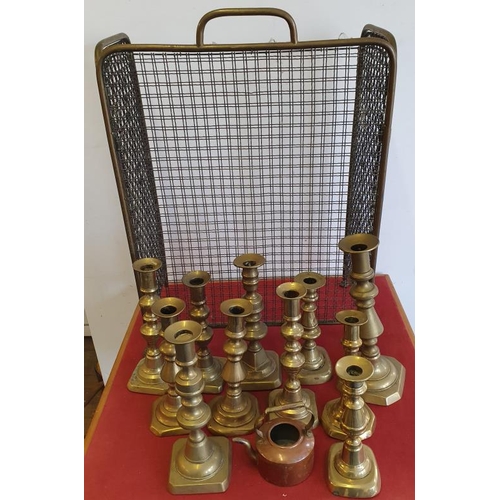 72 - Brass Wire Mesh Fire Screen and a Collection of Antique Brass Candlesticks