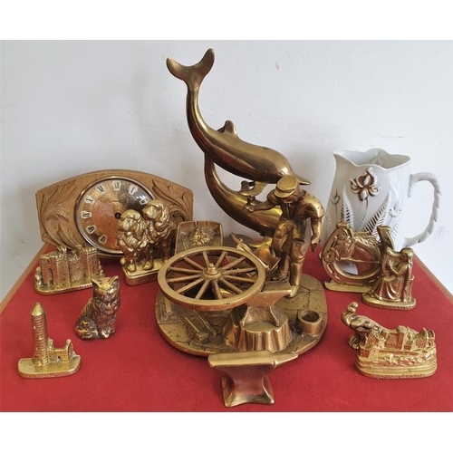 94 - Brass Figure of a Blacksmith at Work, other brass wares, decorative jug and a mantle clock