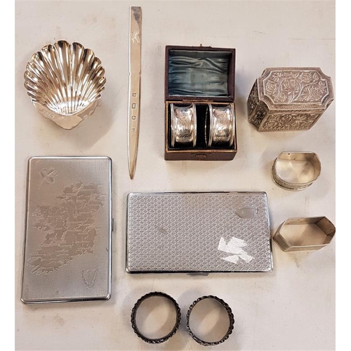 217 - A number of silver items including a scalloped shaped dish, a paper knife, boxed pair of napkin ring... 