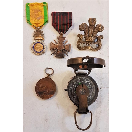 221 - Three war medals including Emergency Service Medal and Donegal Militia cap badge and WW1 compass