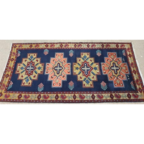 575 - Fine Quality Hand Woven Traditional Eastern Floor Rug with geometric patterns on a blue ground, c.10... 