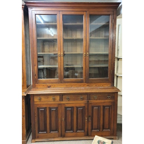 470 - Imposing Victorian Pitch Pine Bookcase, the moulded top above three glazed doors on a panelled base ... 