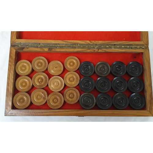 62 - Early 20th Century chess/draughts board with full draughts set, timber pieces, closes to become a bo... 