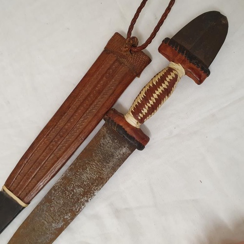 161 - African Double Edged Short Broad Sword engraved Patterned Blade within a Leather Scabbard, c. 1920's