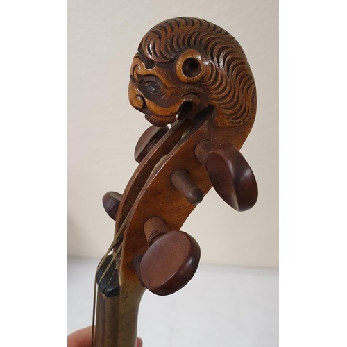 176 - 19th Century Full Size one piece Back Violin with carved lion head. Two bows and assorted extras and... 