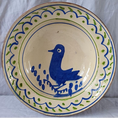 184 - Mid to late 20th Century Slipware Dish with bird decoration. Hand decorated. 11ins diameter