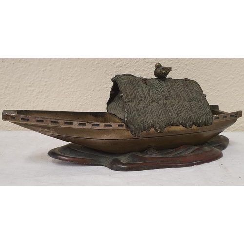 265 - Early 20th Century Bronze Japanese Lake Boat with Perched Bird on Straw Covered Roof, c.10.5in long