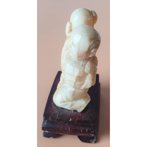 275 - Early 20th Century Carved Ivory Chinese Figure on a Hardwood Stand