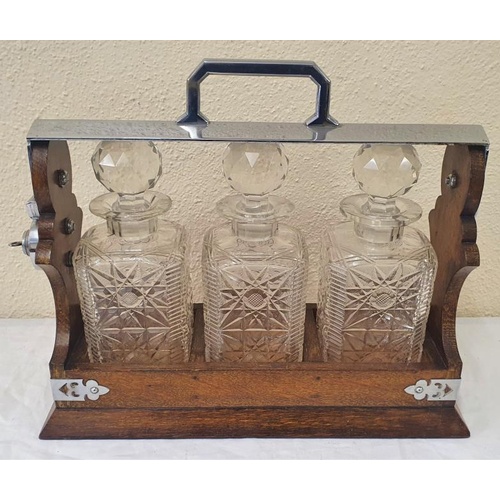 334 - Very Fine 19th Century Three Bottle Oak Tantalus with Silver Plated Mounts with Original Key