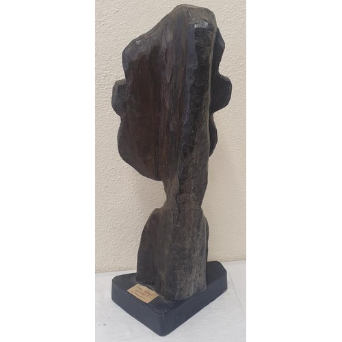 357 - Bog Oak or Yew sculpture of James Joyce. Label behind. c. 22ins tall