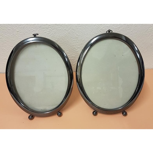 156 - Pair of SIlver Plated Oval Photograph Frames (wall hanging or desk standing). 27 x 21cm diameter