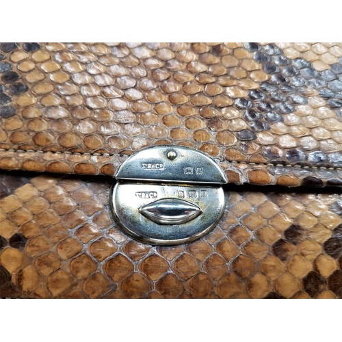 171 - Snake Skin Bag with Silver Clasp (London 126). Silk lined, fitted interior, coin purse, mirror, note... 