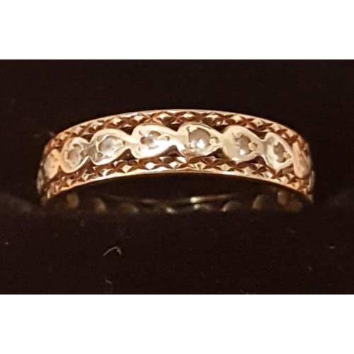 242 - 9ct Gold Diamond Ring (band) with twenty inset small diamonds in a white gold setting, size N+1/2