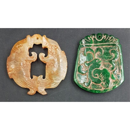 265 - Two Chinese Jade Type Pendants