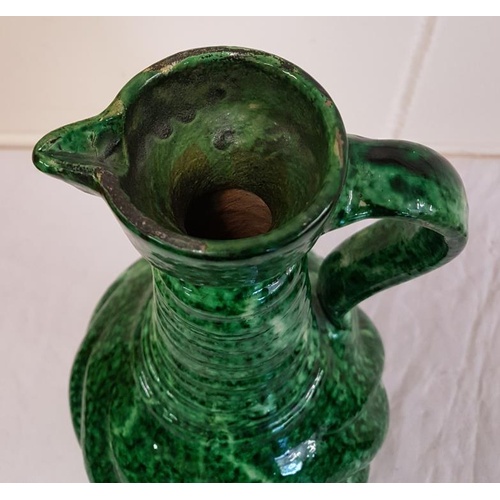 404 - Antique pottery green glazed ewer jug, 13