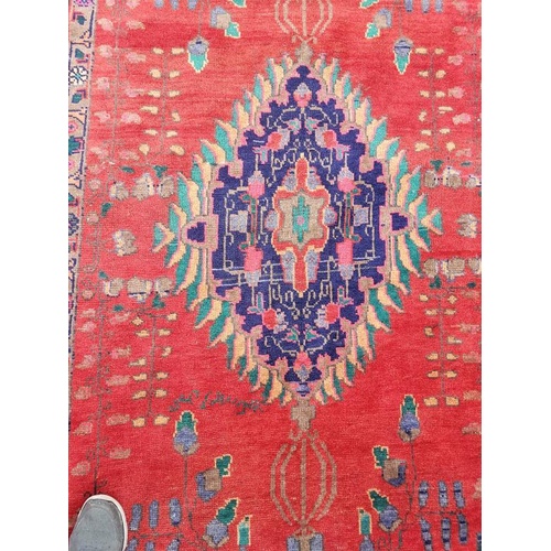 445 - Large handmade Iranian wool carpet. Floral pattern with central medallion and tribal border. Good pi... 