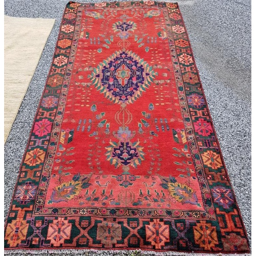 445 - Large handmade Iranian wool carpet. Floral pattern with central medallion and tribal border. Good pi... 