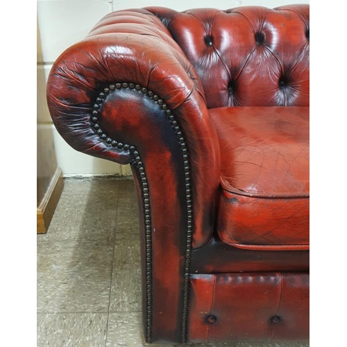 465 - Chesterfield Deep Button Two Seat Settee in oxblood red, c.55in wide
