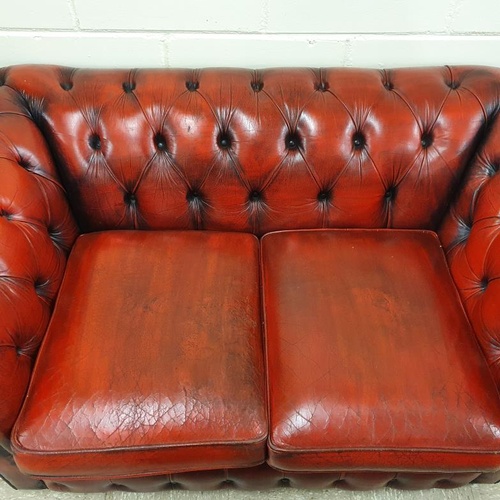 465 - Chesterfield Deep Button Two Seat Settee in oxblood red, c.55in wide