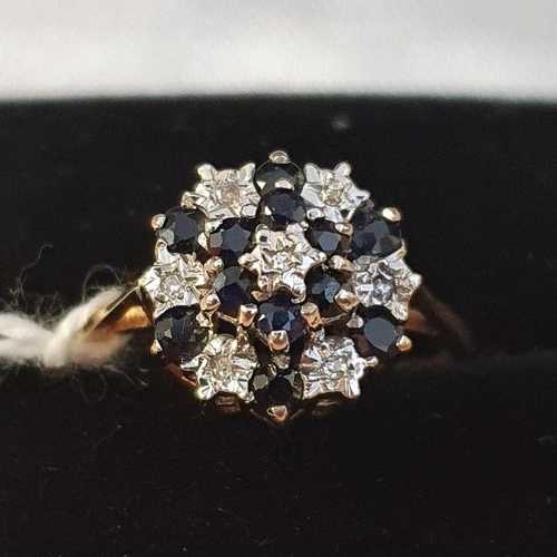236 - 9ct Gold Sapphire and Dianond Cluster ring with seven inset diamonds and twelve inset sapphires, siz... 