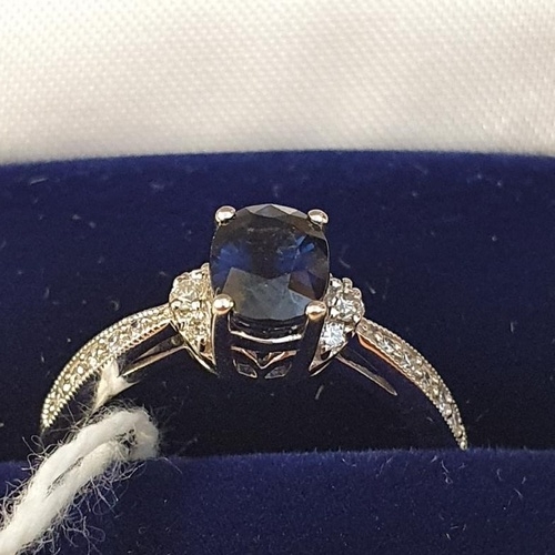 237 - Fine Quality 18ct White Gold Diamond and Sapphire Ring. The central oval sapphire flanked by three l... 