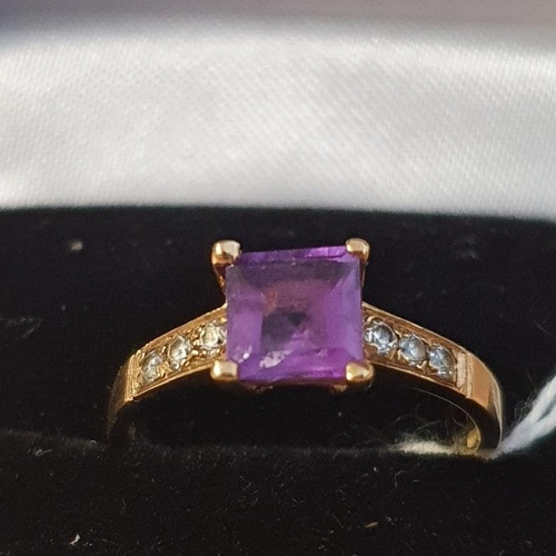 238 - 9ct Gold and Amethyst and Diamond Ring. Central Amethyst with three inset Diamonds on each shoulder.... 