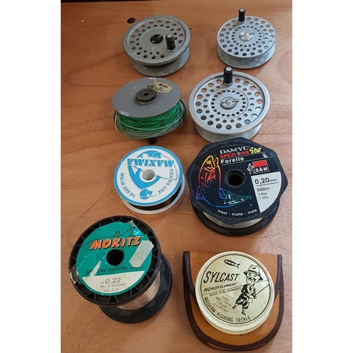 Four Fishing Line Spools and a Collection of Fishing Line