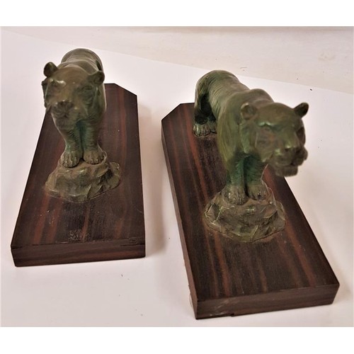 166 - Pair of Art Deco Bronzed effect Lions on Zebra Wood bases. Nice patination - 7.5 x 5ins