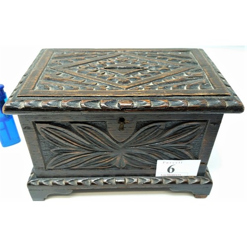6 - A 19th Century carved oak money box in the form of a coffer, Floral carved design . T... 