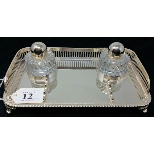 12 - A good quality early to mid 20th Century silver plated desk set with two glass ink wells w... 