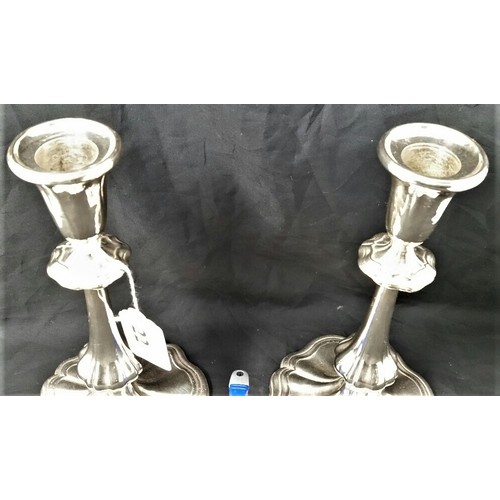 22 - A good pair of early 20th Century Silver plated Candlesticks in much loved condition 9 inches t... 