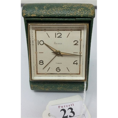 23 - A vintage Retro travel clock with a green shagreen case in full working condition
