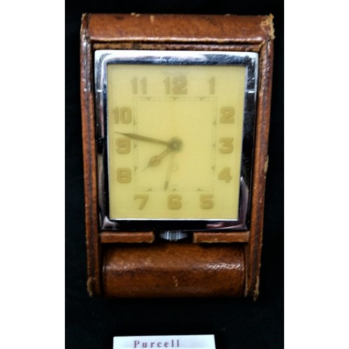 47 - Jaeger- Le Coultre vintage travel clock in leather case. Clock has been wound and is working. Some l... 