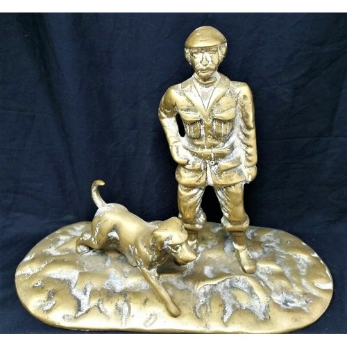 56 - Early to mid 20th century heavy brass huntsman with dog 10 inches wide x 8 inche... 