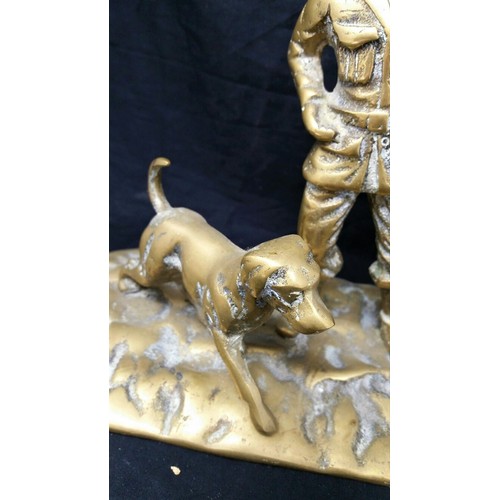 56 - Early to mid 20th century heavy brass huntsman with dog 10 inches wide x 8 inche... 