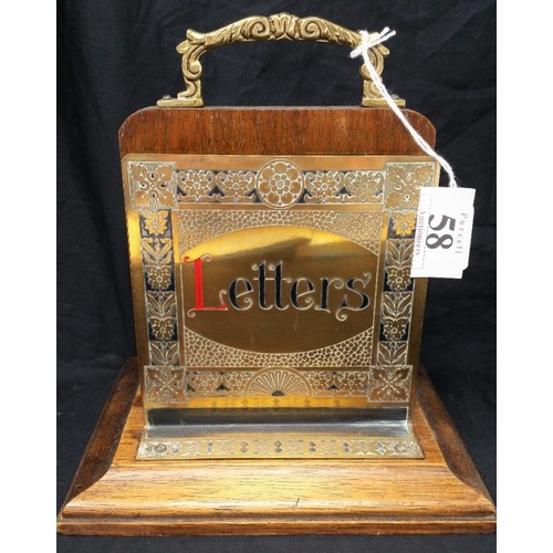 58 - Early 20th century double sided letter rack with painted brass panels on a mahogany base