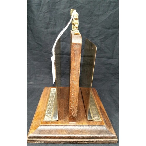 58 - Early 20th century double sided letter rack with painted brass panels on a mahogany base