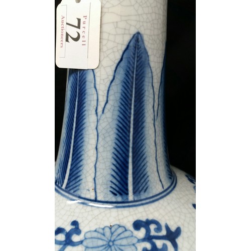 72 - A large pair of late 20th century bottle neck vases with underglaze blue floral pattern. No chi... 