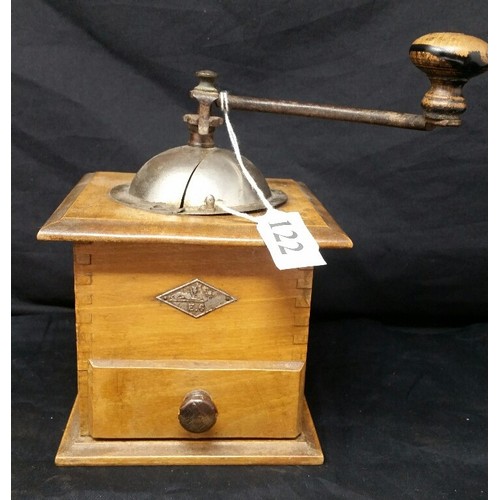 122 - A vintage coffee grinder in working condition.  No damages.  7.75 inches high x 5.5 inches... 