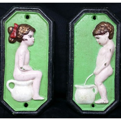 128 - A good pair of heavy cast iron boy and girl bathroom / toilet signs . Both 7 inches tall x... 