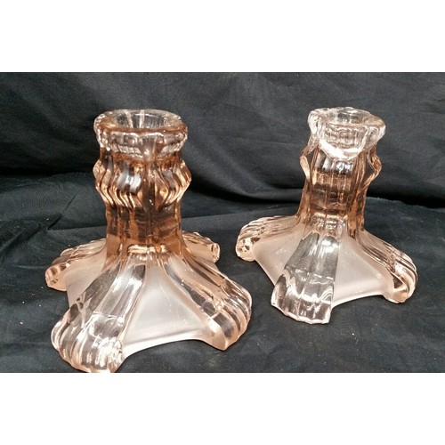 129 - Art Deco pink glass dressing table set with a pair of candlesticks, lidded ring jar and jewellery tr... 