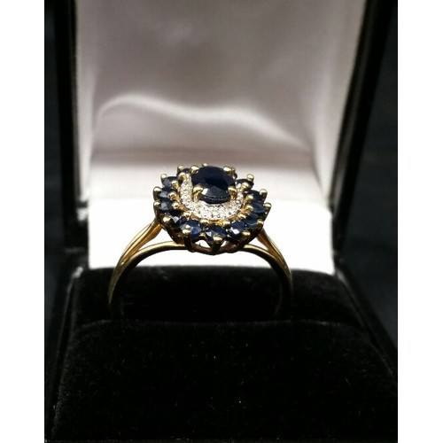 143 - 9ct Gold oval shaped Sapphire & Diamond ring.  Central oval sapphire surrounded by 12 diamo... 