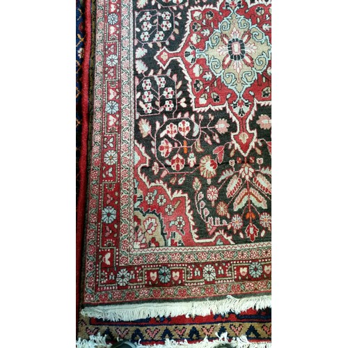 220 - A semi old handmade Iranian carpet with central medallion 100% pure wool full pile fringed to one en... 