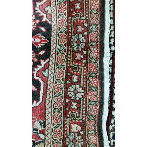 220 - A semi old handmade Iranian carpet with central medallion 100% pure wool full pile fringed to one en... 