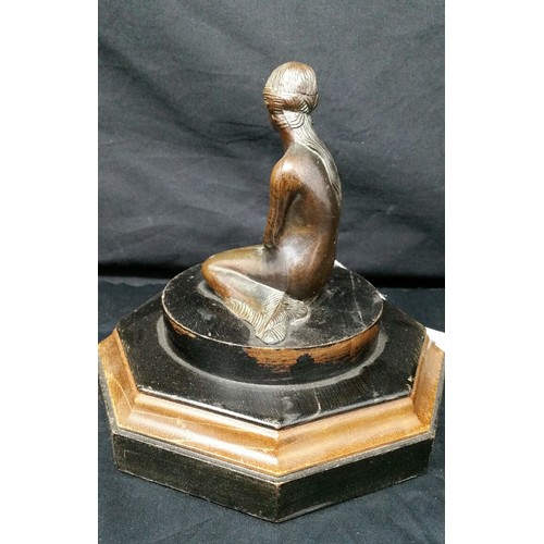 223 - Art deco bronze effect figure on a part ebonized wooden base. Good patina. Size 6 inches tall x 5.75... 