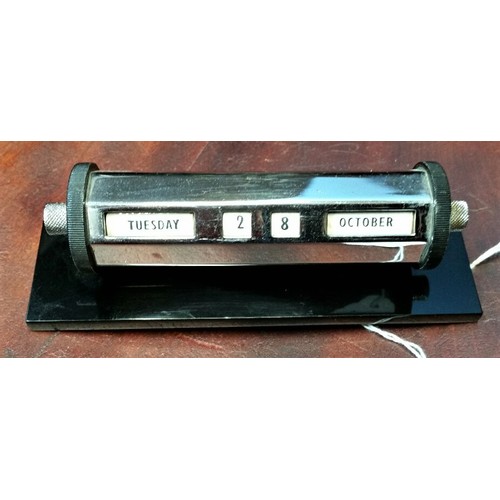 229 - 1930/40’s Chrome desk calendar on a heavy bakelite base. 5.75 inches wide x 2 inches high. Con... 